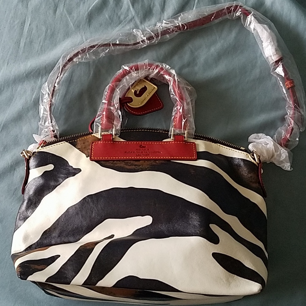 Dooney & Bourke zebra or cow print purse